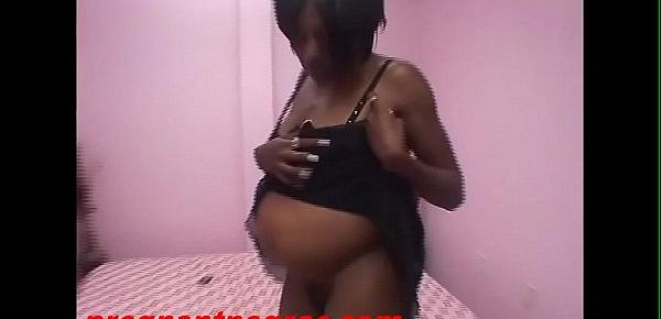  Big ass black pregnant whore gets pussy banged by white cock and cum on belly